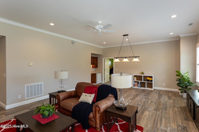 living room featuring baseboards, ceiling fan, wood finished floors, and visible vents