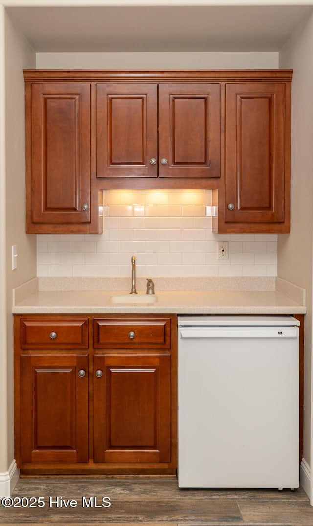 118 Dennis Cir W, End, NC 27376 - kitchen featuring white dishwasher, a sink, baseboards, and tasteful backsplash