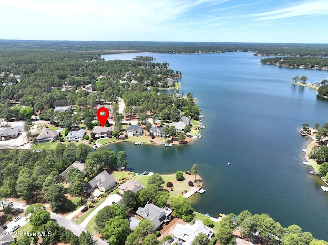 aerial view with a water view, a residential view, and a wooded view