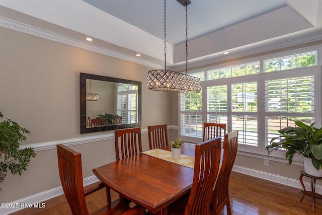 dining area with baseboards, plenty of natural light, dark wood finished floors, and a notable chandelier