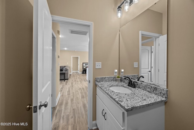 1203 English Colony Pl, Washington, NC 27889 - bathroom with wood finished floors, vanity, and baseboards