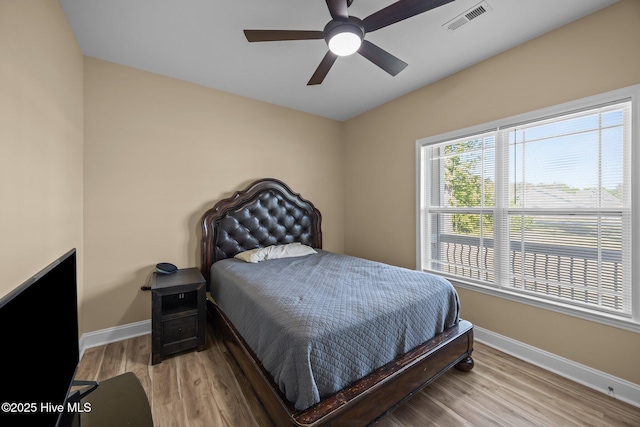 1203 English Colony Pl, Washington, NC 27889 - bedroom with baseboards, wood finished floors, and ceiling fan