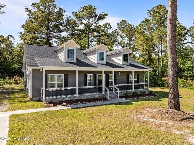 1203 English Colony Pl, Washington, NC 27889 - cape cod home with covered porch and a front lawn