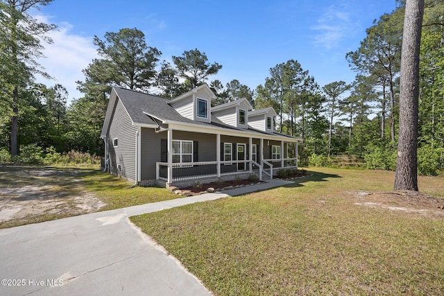 1203 English Colony Pl, Washington, NC 27889 - cape cod home with a porch, a front lawn, and a shingled roof