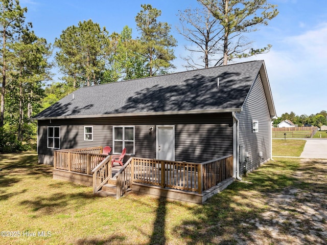 1203 English Colony Pl, Washington, NC 27889 - rear view of property with a wooden deck, a shingled roof, and a yard
