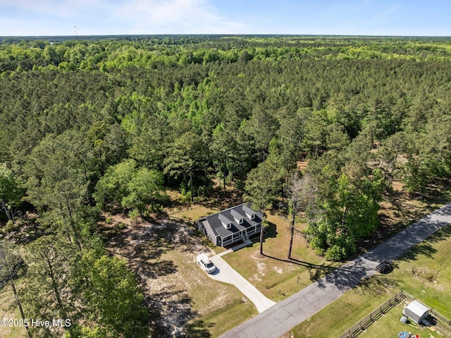 bird's eye view featuring a view of trees