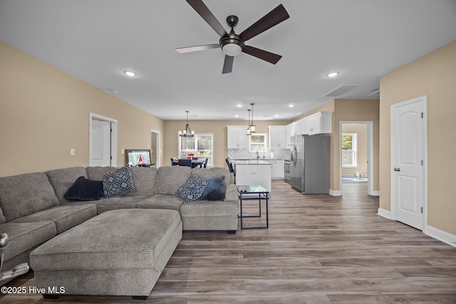 1203 English Colony Pl, Washington, NC 27889 - living area with a ceiling fan, light wood finished floors, plenty of natural light, recessed lighting, and baseboards