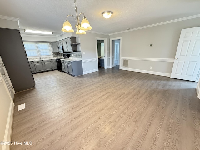 120 Ridgecrest Dr, Mount Olive, NC 28365 - kitchen with light wood-style floors, light countertops, gray cabinets, and a chandelier
