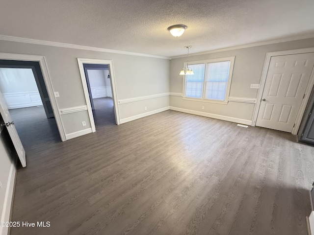 120 Ridgecrest Dr, Mount Olive, NC 28365 - unfurnished dining area with crown molding, baseboards, a textured ceiling, dark wood finished floors, and a notable chandelier