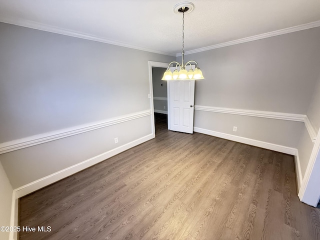 120 Ridgecrest Dr, Mount Olive, NC 28365 - unfurnished dining area with baseboards, an inviting chandelier, ornamental molding, and wood finished floors