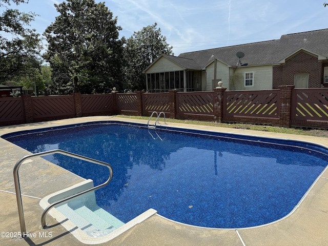 120 Ridgecrest Dr, Mount Olive, NC 28365 - view of swimming pool with a fenced in pool, a sunroom, and a fenced backyard