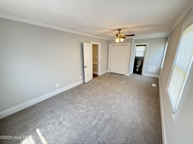 120 Ridgecrest Dr, Mount Olive, NC 28365 - unfurnished bedroom featuring baseboards, multiple windows, and carpet flooring