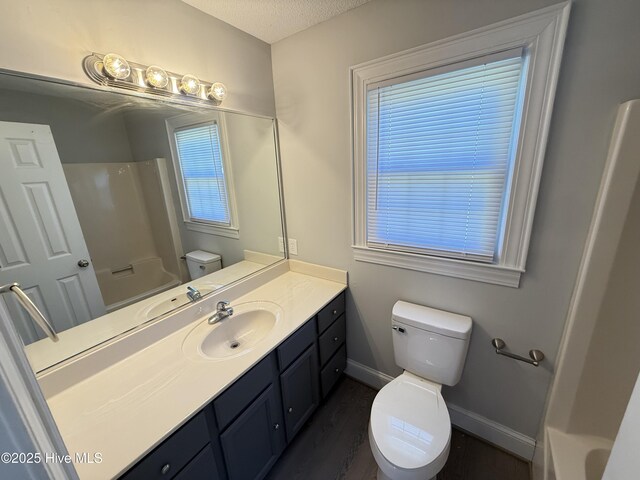 120 Ridgecrest Dr, Mount Olive, NC 28365 - full bath featuring vanity, tub / shower combination, wood finished floors, toilet, and baseboards