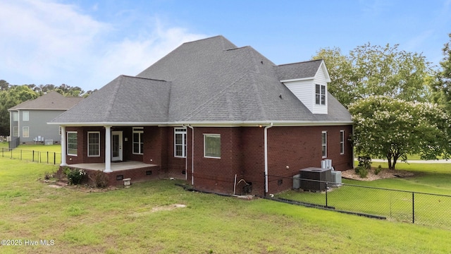 106 Cliffwell Dr, Goldsboro, NC 27530 - rear view of property featuring brick siding, central AC, and a shingled roof