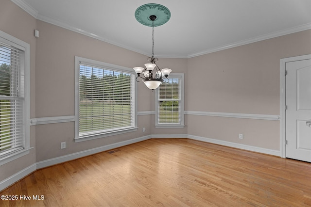 106 Cliffwell Dr, Goldsboro, NC 27530 - unfurnished dining area with a chandelier, wood finished floors, baseboards, and ornamental molding