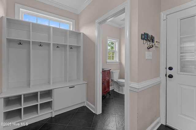 106 Cliffwell Dr, Goldsboro, NC 27530 - mudroom featuring ornamental molding, baseboards, and dark tile patterned floors