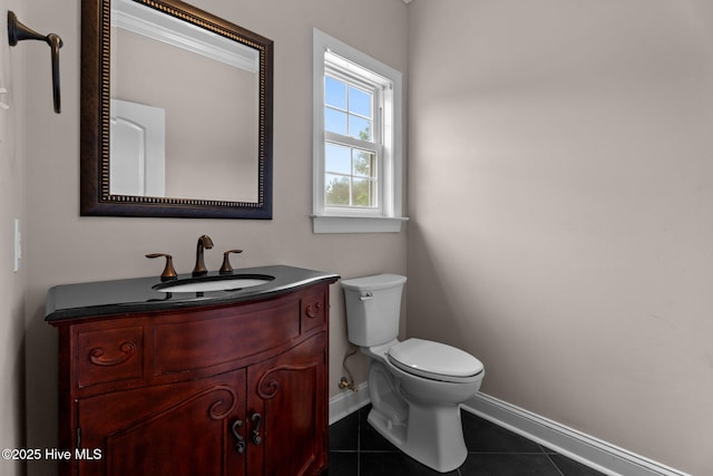106 Cliffwell Dr, Goldsboro, NC 27530 - half bath with baseboards, tile patterned floors, toilet, and vanity