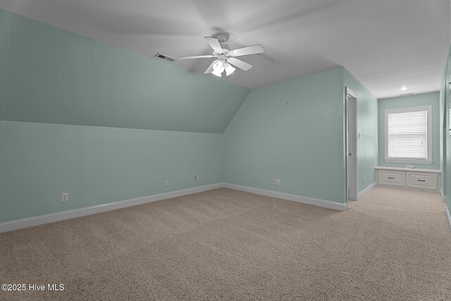106 Cliffwell Dr, Goldsboro, NC 27530 - additional living space with ceiling fan, baseboards, light carpet, and vaulted ceiling
