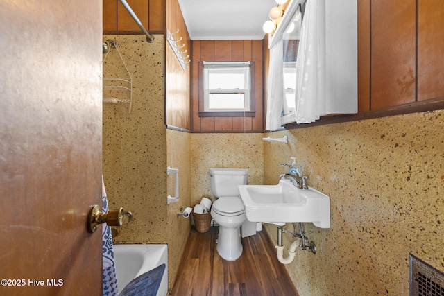 421 35th St, Sunset Beach, NC 28468 - bathroom with wood finished floors, toilet, and a sink