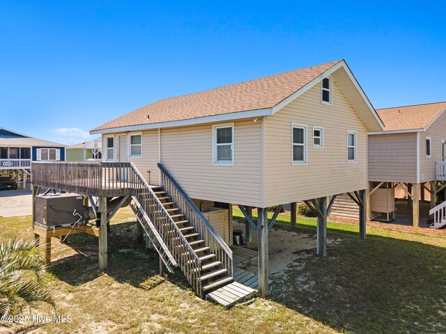 421 35th St, Sunset Beach, NC 28468 - back of house featuring stairs, roof with shingles, a deck, cooling unit, and a carport
