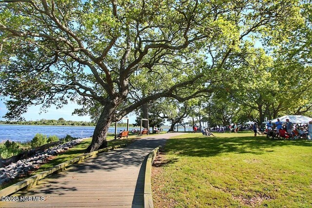 421 35th St, Sunset Beach, NC 28468 - view of community with a water view and a lawn