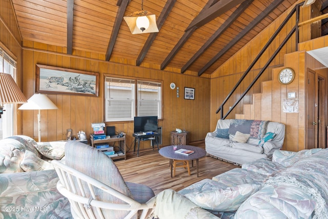 421 35th St, Sunset Beach, NC 28468 - living area featuring wooden walls, wooden ceiling, wood finished floors, and stairs