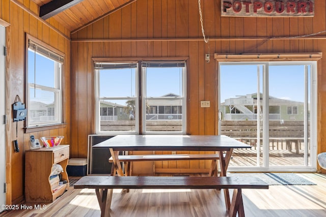 421 35th St, Sunset Beach, NC 28468 - dining area featuring wood walls, wooden ceiling, and wood finished floors