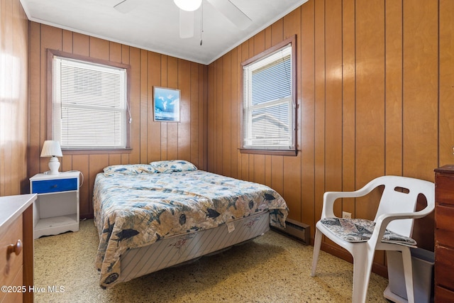 421 35th St, Sunset Beach, NC 28468 - bedroom featuring multiple windows, a baseboard radiator, and ceiling fan