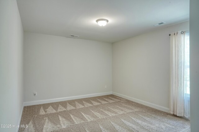 230 Lookout Ln, Sneads Ferry, NC 28460 - spare room featuring light carpet, baseboards, and visible vents