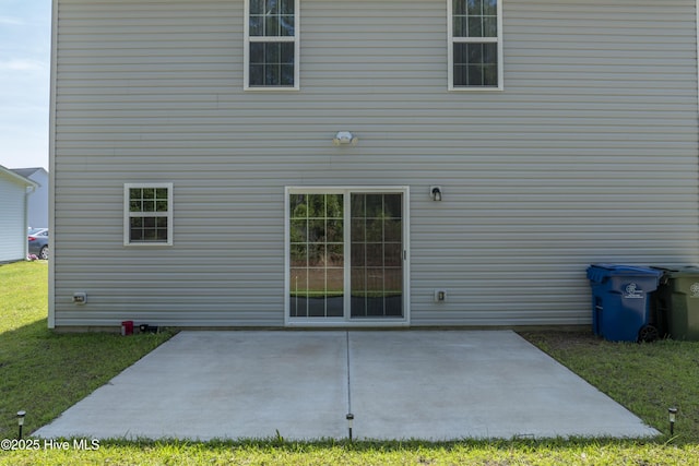 230 Lookout Ln, Sneads Ferry, NC 28460 - back of property with a yard and a patio area