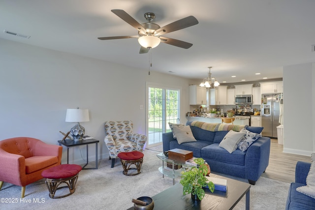 230 Lookout Ln, Sneads Ferry, NC 28460 - living room featuring baseboards, recessed lighting, visible vents, and ceiling fan with notable chandelier