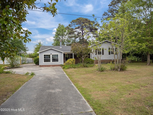 40 Eagle Rock Ln, Hubert, NC 28539 - bungalow-style house with fence, driveway, and a front yard