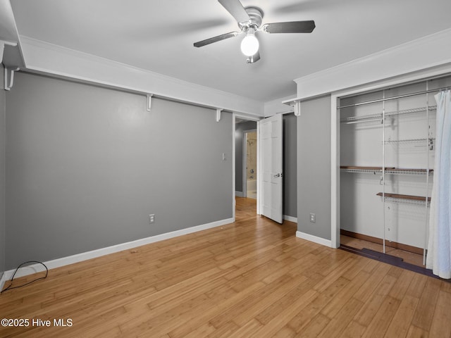 40 Eagle Rock Ln, Hubert, NC 28539 - unfurnished bedroom with ceiling fan, crown molding, baseboards, a closet, and light wood-style floors