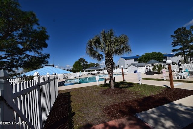 5017 Bucco Reef Rd, New Bern, NC 28560 - view of yard featuring fence, a community pool, and a patio area
