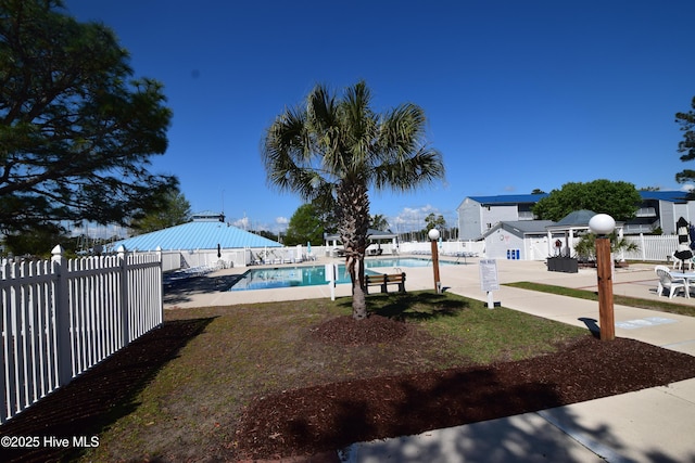 5017 Bucco Reef Rd, New Bern, NC 28560 - fenced backyard with a community pool and a patio area