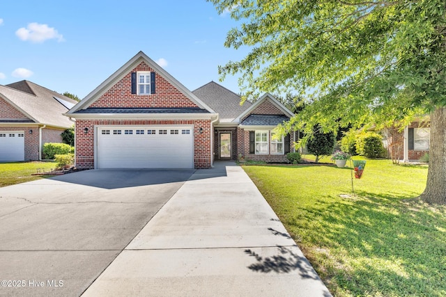 view of front of property featuring driveway, brick siding, a front yard, and an attached garage