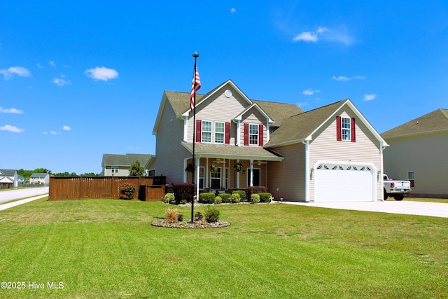 traditional home with covered porch, fence, a front lawn, concrete driveway, and an attached garage