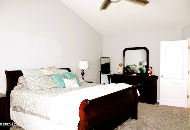 bedroom with a ceiling fan, lofted ceiling, and carpet