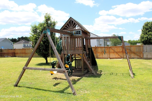 view of jungle gym with a lawn and a fenced backyard