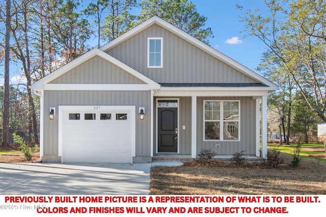 view of front of house with a garage, a porch, and concrete driveway