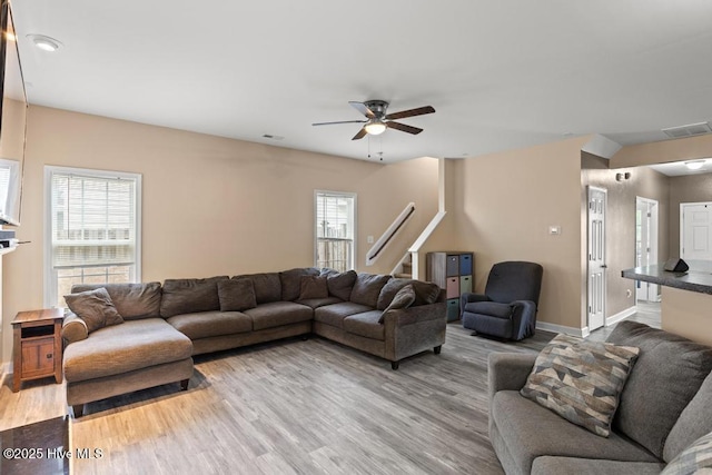248 Seville St, Jacksonville, NC 28546 - living area featuring ceiling fan, wood finished floors, baseboards, and stairs