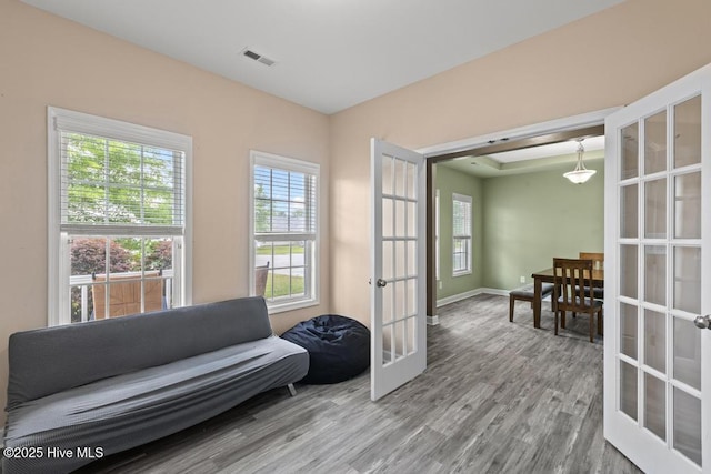 248 Seville St, Jacksonville, NC 28546 - sitting room featuring french doors, wood finished floors, and baseboards