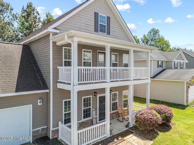 248 Seville St, Jacksonville, NC 28546 - back of house with a balcony, roof with shingles, a garage, and a porch