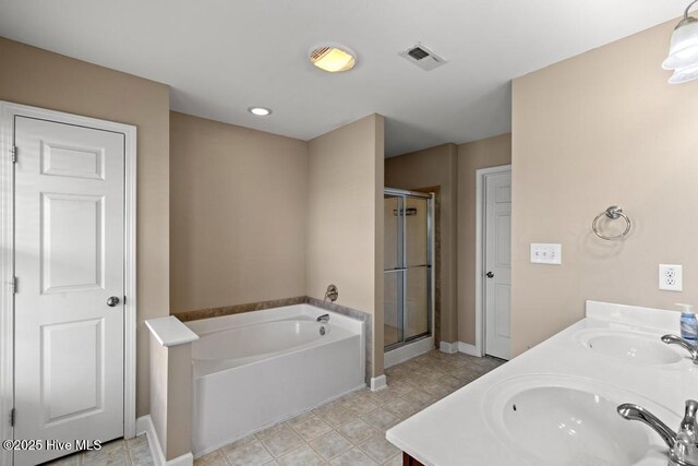 248 Seville St, Jacksonville, NC 28546 - full bath with a bath, a stall shower, baseboards, and double vanity