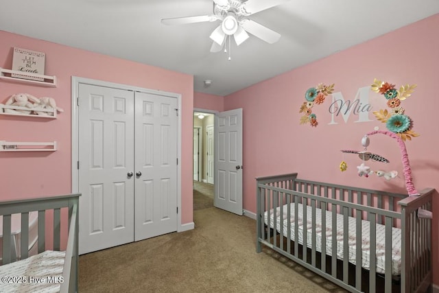 248 Seville St, Jacksonville, NC 28546 - bedroom featuring carpet flooring, a closet, baseboards, a crib, and a ceiling fan