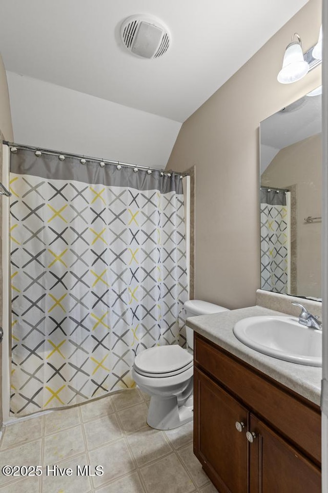 248 Seville St, Jacksonville, NC 28546 - bathroom with vaulted ceiling, vanity, toilet, and a shower with shower curtain