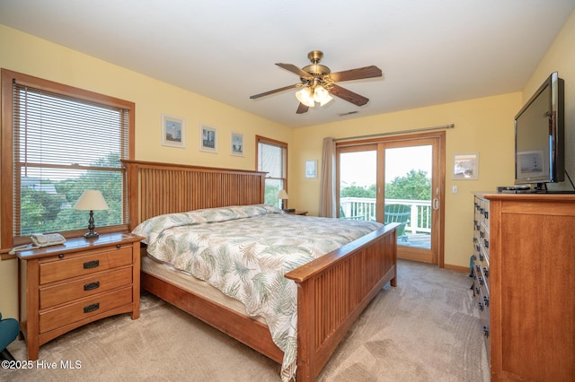 bedroom with visible vents, light carpet, baseboards, ceiling fan, and access to outside