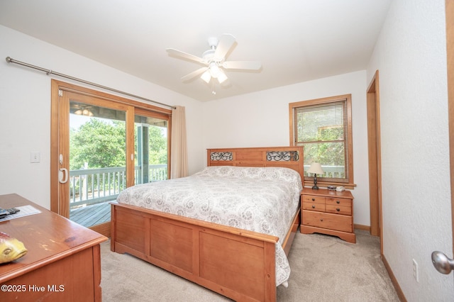 bedroom featuring access to outside, ceiling fan, and light carpet