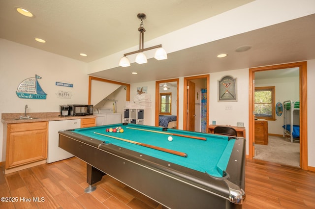 game room featuring pool table, a sink, indoor wet bar, recessed lighting, and light wood-style flooring
