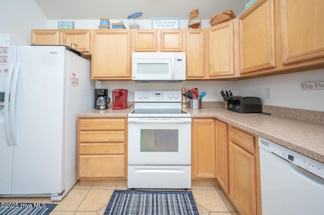 kitchen featuring white appliances, light brown cabinetry, light tile patterned floors, and light countertops